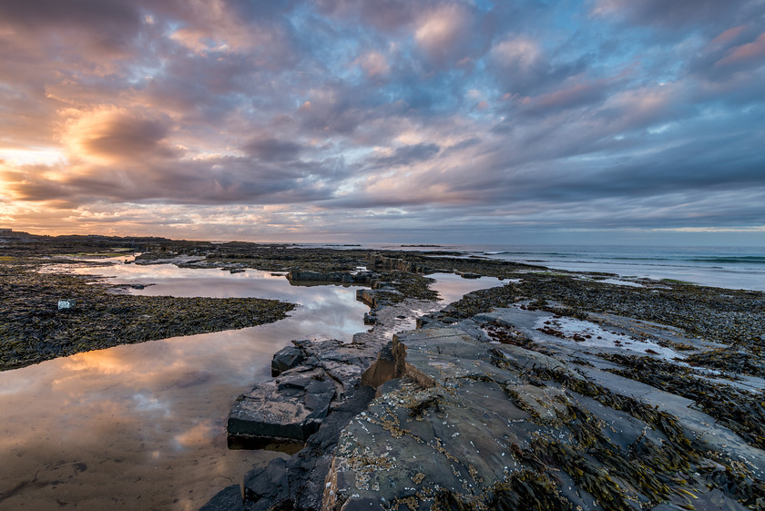 Northumbrian Sky 
 www.keithmuirphoto.co.uk 
 Keywords: Bamburgh, England, Northumbria, beach, clouds, coast, dusk, landscapes, reflections, sea, seascapes, shore, sunset, waves