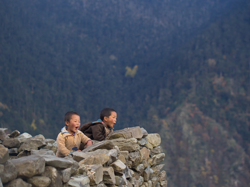 Shouting from the Rooftops, Merak Village 
 Keywords: Bhutan, Brokpas, Eastern Bhutan, Merak, Olympus, people, portraits