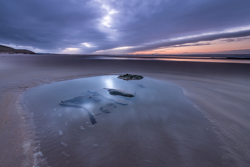 Sand Pool 
 www.keithmuirphoto.co.uk 
 Keywords: Bamburgh, England, Northumbria, Sky, beach, clouds, coast, landscapes, sea, seascapes, shore, sunset, water, waves