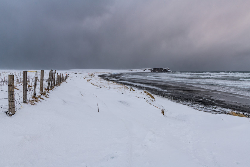 DSC5123 
 www.keithmuirphoto.co.uk 
 Keywords: Húsavík, Iceland, North East Iceland, WPH, beach, black sand, clouds, cold, dark, landscapes, sea, seascapes, shore, snow, travel, winter