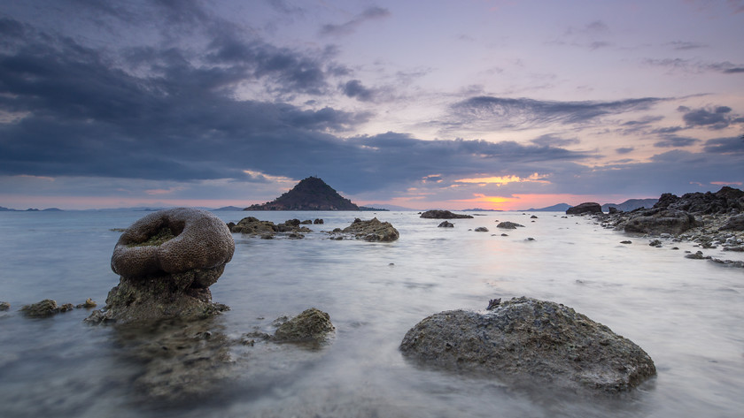 Coral Breaking the Waves 
 Coral at low tide, Kelor Island, Komodo National Park 
 Keywords: Indonesia, Kelor Island, coast, landscapes, sea, seascapes, shore, sunset, travel