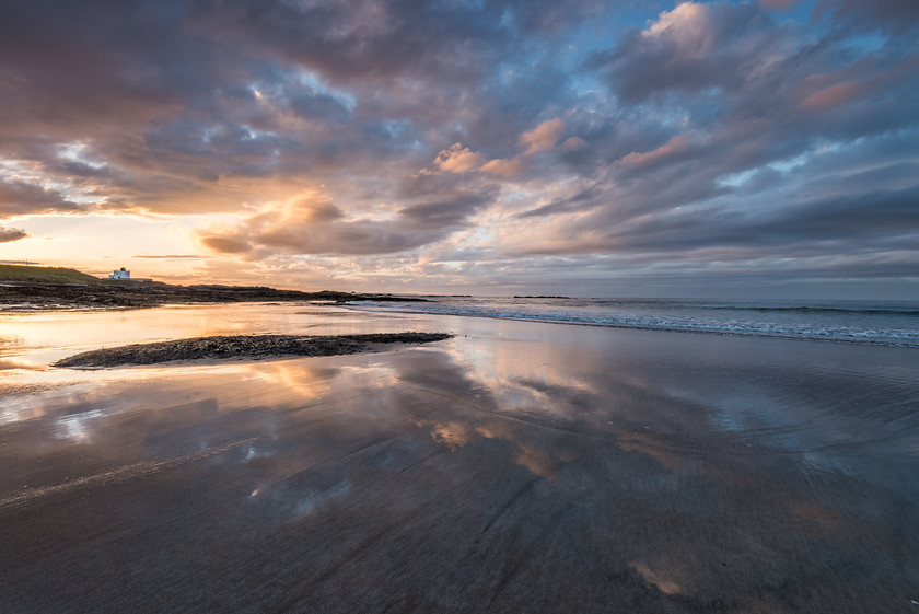 Reflected 
 www.keithmuirphoto.co.uk 
 Keywords: Bamburgh, England, Northumbria, beach, clouds, coast, dusk, landscapes, reflections, sea, seascapes, shore, sunset, waves