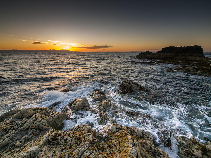 Sunset over Arran, Dunure 
 Seascape, Dunure, Ayrshire 
 Keywords: Ayrshire, Dunure, Scotland, West Coast, landscapes, sea, seascapes, shore, sunset, waves, rocks