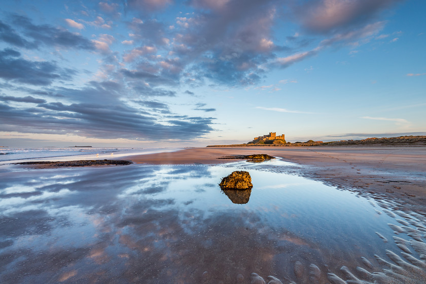 Bamburgh Beach Evening 
 www.keithmuirphoto.co.uk 
 Keywords: Bamburgh, England, Northumbria, beach, clouds, coast, dusk, landscapes, reflections, sea, seascapes, shore, sunset, waves